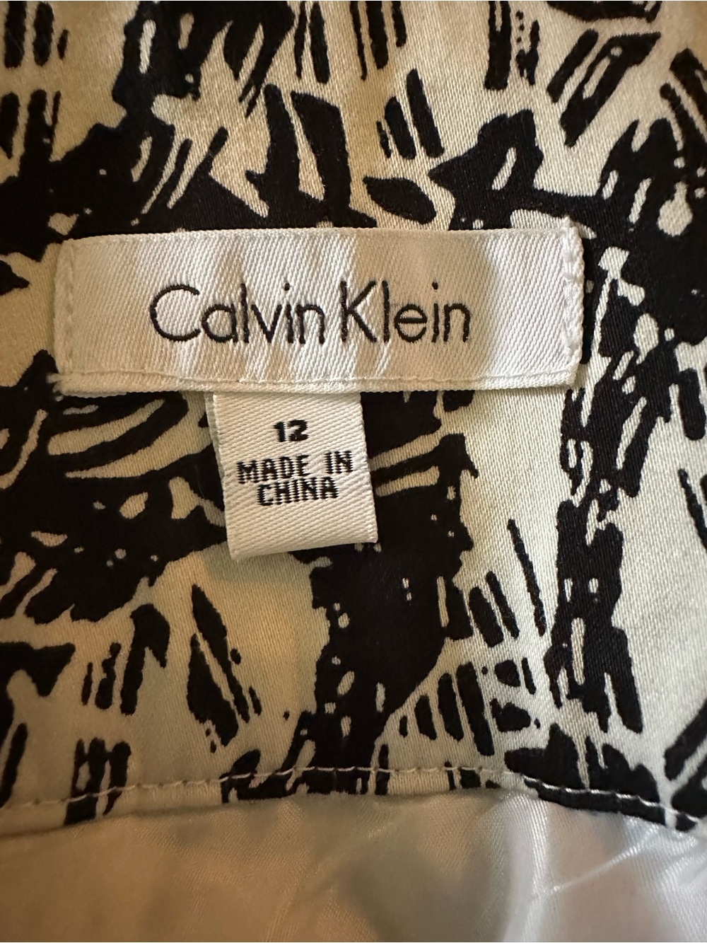 Calvin Klein Black/White print lined skirt.